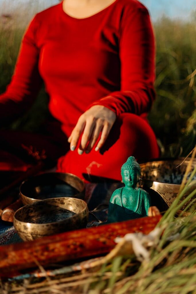 Person in Red Long Sleeve Shirt Holding Green Ceramic Bowl